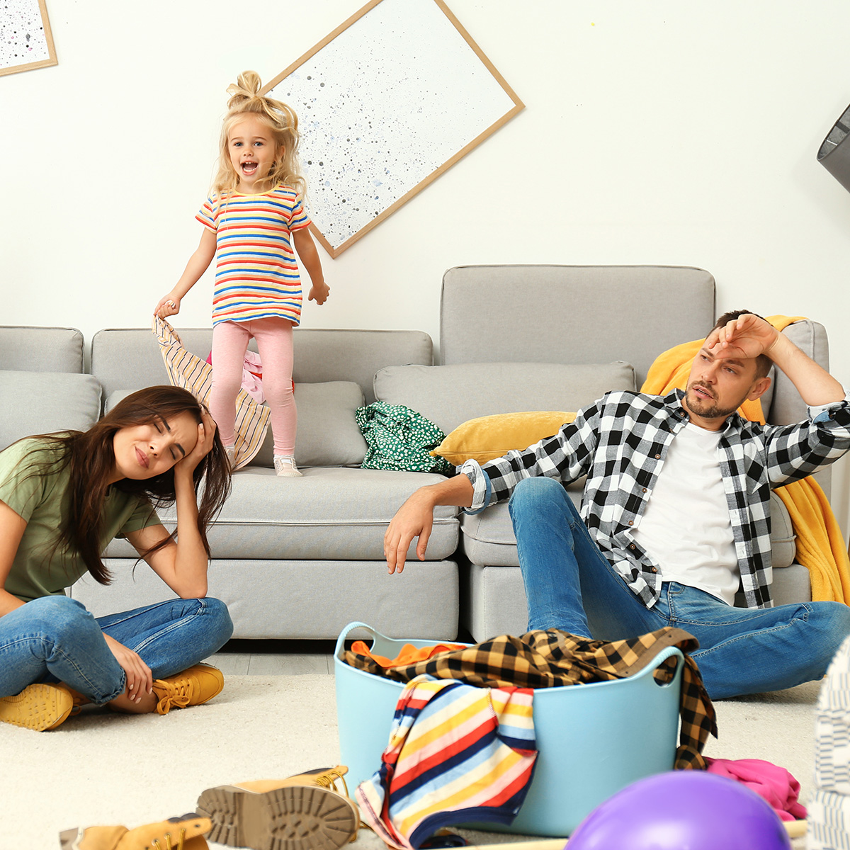 parents exhausted while kids creating chaos around them.